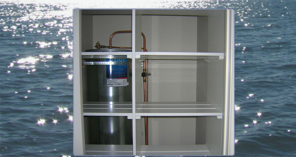 Custom white shelves in hot water cupboard for drying and storage
