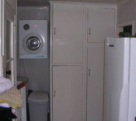 "Before" photo of laundry storage at a home in Thames New Zealand